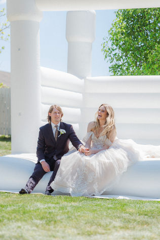 Bride and groom having fun at wedding in Grand Junction.