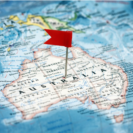 Red pin marks Australia on a blue world map, with Australia text visible.