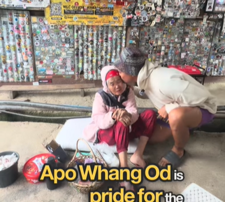 Tourist proudly showing a traditional Kalinga tattoo by Apo Whang-od, highlighting Filipino cultural art and authentic tattoo