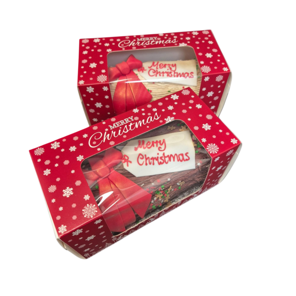 Beautifully decorated Christmas logs cake with a festive design, perfect for the holiday season celebrations.