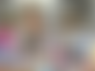 Woman sits at table surrounded by menopause & anti-aging products