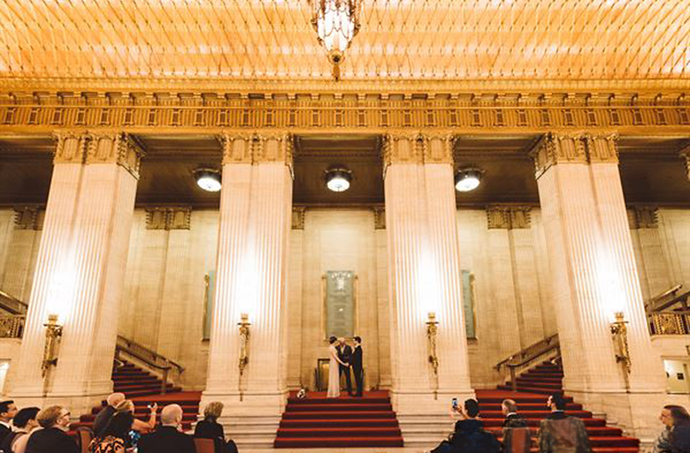 Wedding ceremony arranged on the grand staircase inside the Lyric Opera of Chicago.
