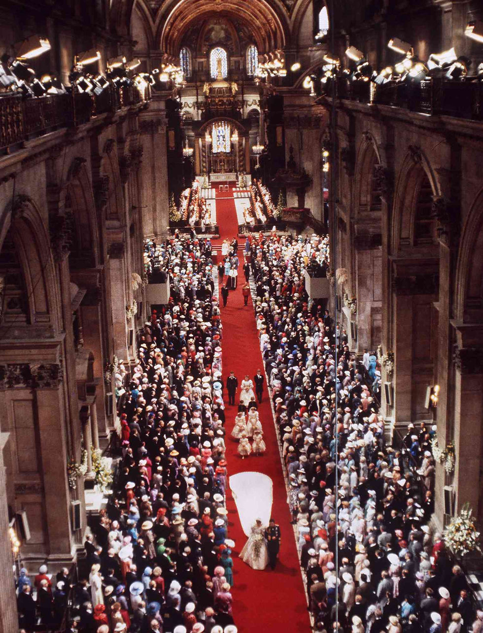 Aerial interior view of Princess Diana’s royal wedding at St. Paul’s Cathedral showing the red carpet aisle and ceremonial procession.