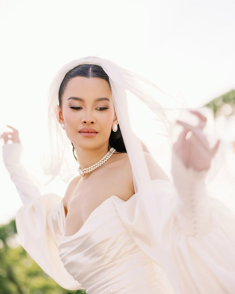 Bride in a veil portrait during a modern wedding editorial-style moment