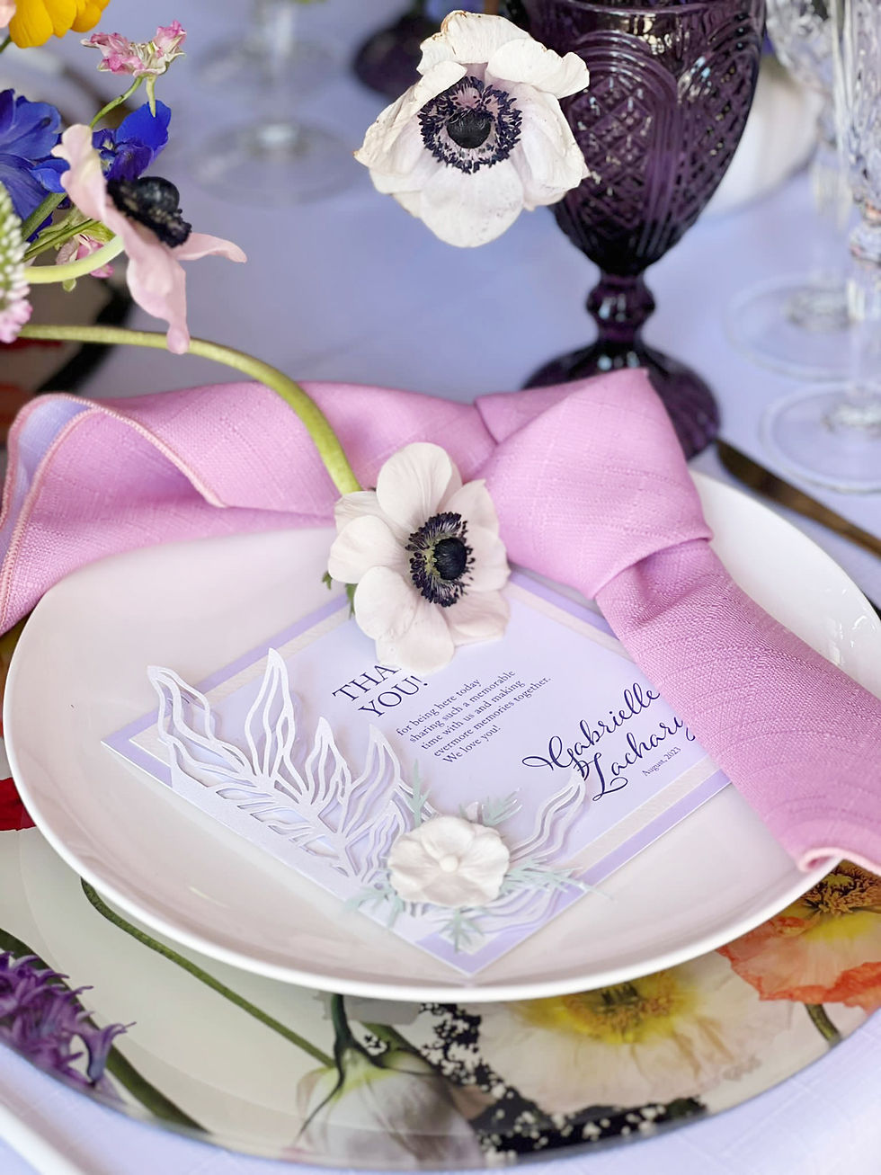 Bespoke menu on a whimsical table setting.