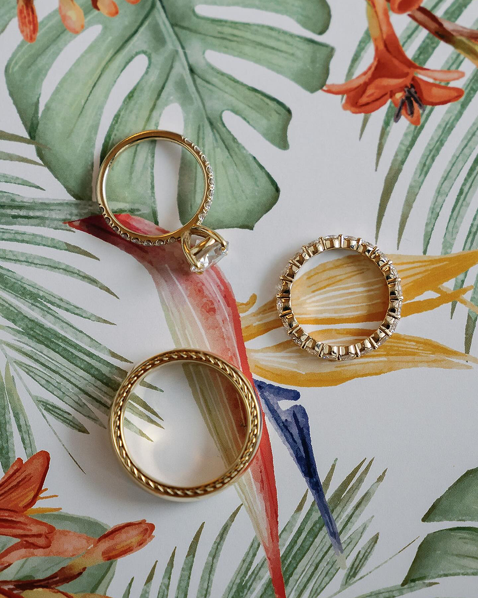 Multi-day wedding stationery detail with botanical motif and layered design elements introducing palette continuity.