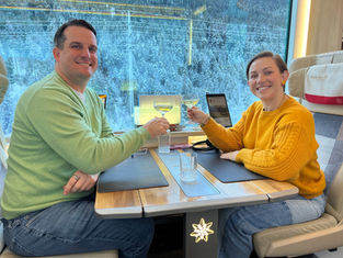 A couple enjoying the Glacier Express booking that The Mountain Company had secured