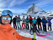 many people standing in a line in front of The Matterhorn