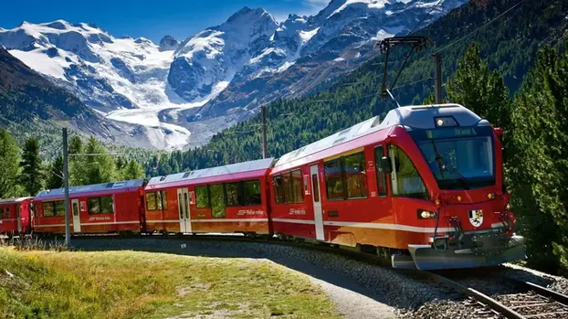 A Swiss train is coming forward along the tracks with beautiful mountain views as a science background.