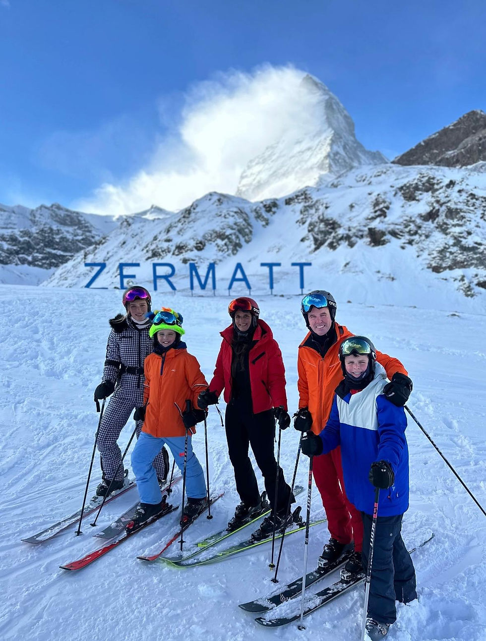 people enjoying a ski day with a mountain company guide