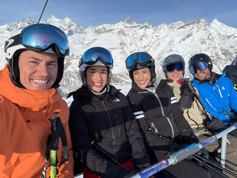 a ski guide in Zermatt takes a selfie on the chairlift 