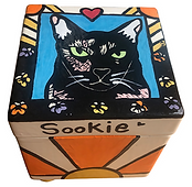 Square hand-painted cat urn with a black cat named Sookie and bright orange sun design