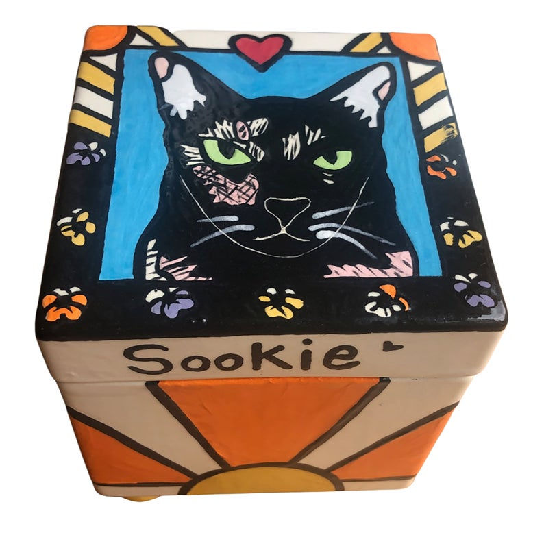 Thumbnail: Cat box urn with black cat, red heart, paw prints, sunburst design, and name “Sookie.”