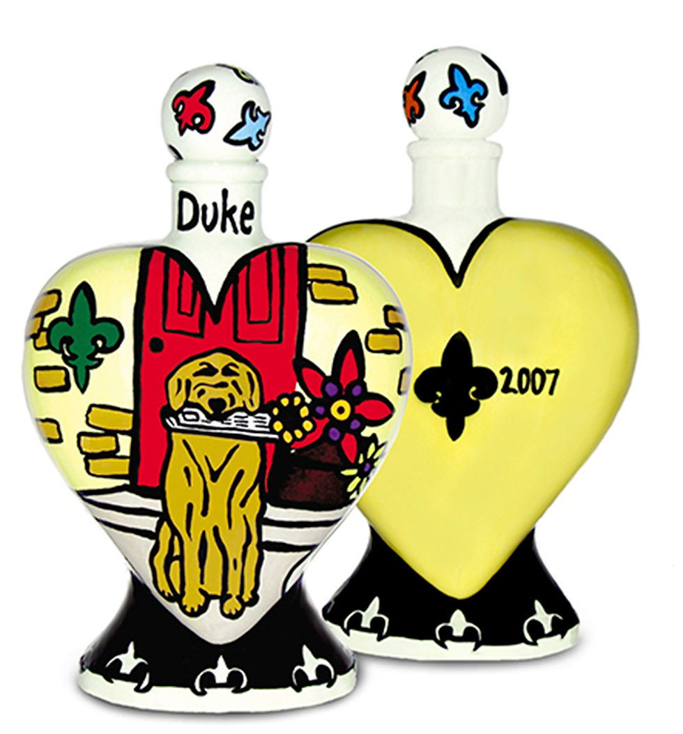 Thumbnail: Dog heart vase urn a golden retriever, yellow back and black fleur-de-lis on reverse side