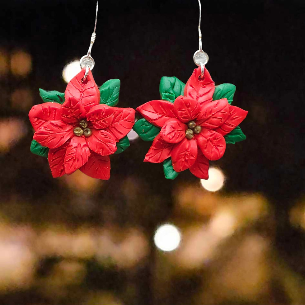 Julörhängen med röda julstjärnor mot en mörk bakgrund