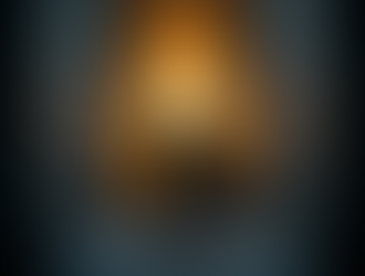 A man in a long dark coat runs alone down a stone corridor toward a blinding amber light, his back to the viewer.