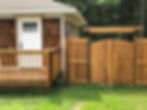 Cedar shake house with wooden deck and custom gate