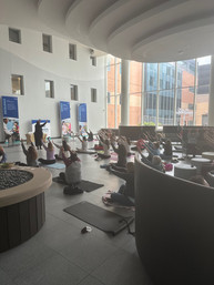 Participants raising their arms during a sound healing and somatic exercise session led by Andrea Joy Pearson at Children’s Nebraska.