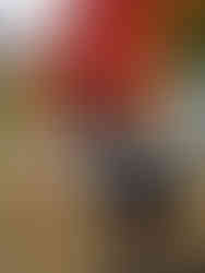 Andrea Joy Pearson being recorded while seated in front of crystal singing bowls for a custom on-demand sound healing video.