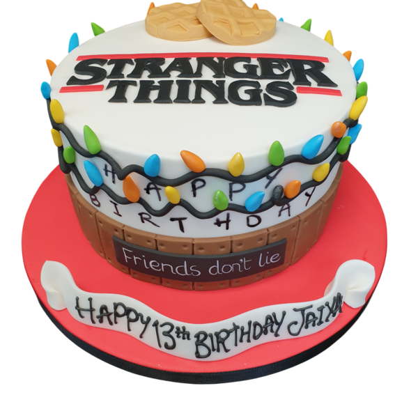 A spooky and colourful cake inspired by the popular TV show, featuring iconic elements from the series in a vibrant and eye-catching design.