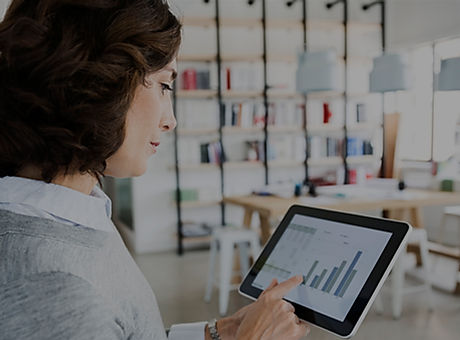 Woman Checking Data on Tablet
