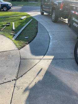 replaced section of broom finished driveway