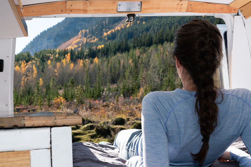 renting a campervan and looking out the back to a mountain view