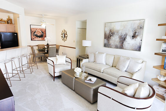 Open-concept living room at Springbrook Cercle featuring natural light, modern finishes, and comfortable residential design.