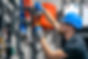 man-installs-heating-system-house-checks-pipes-with-wrench.jpg