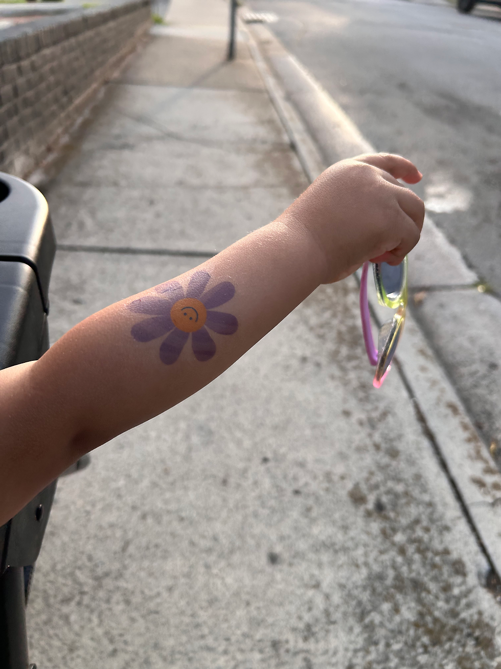 arm with flower tattoo