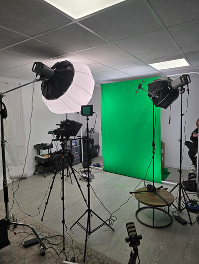 Professional videography studio with green screen and lights