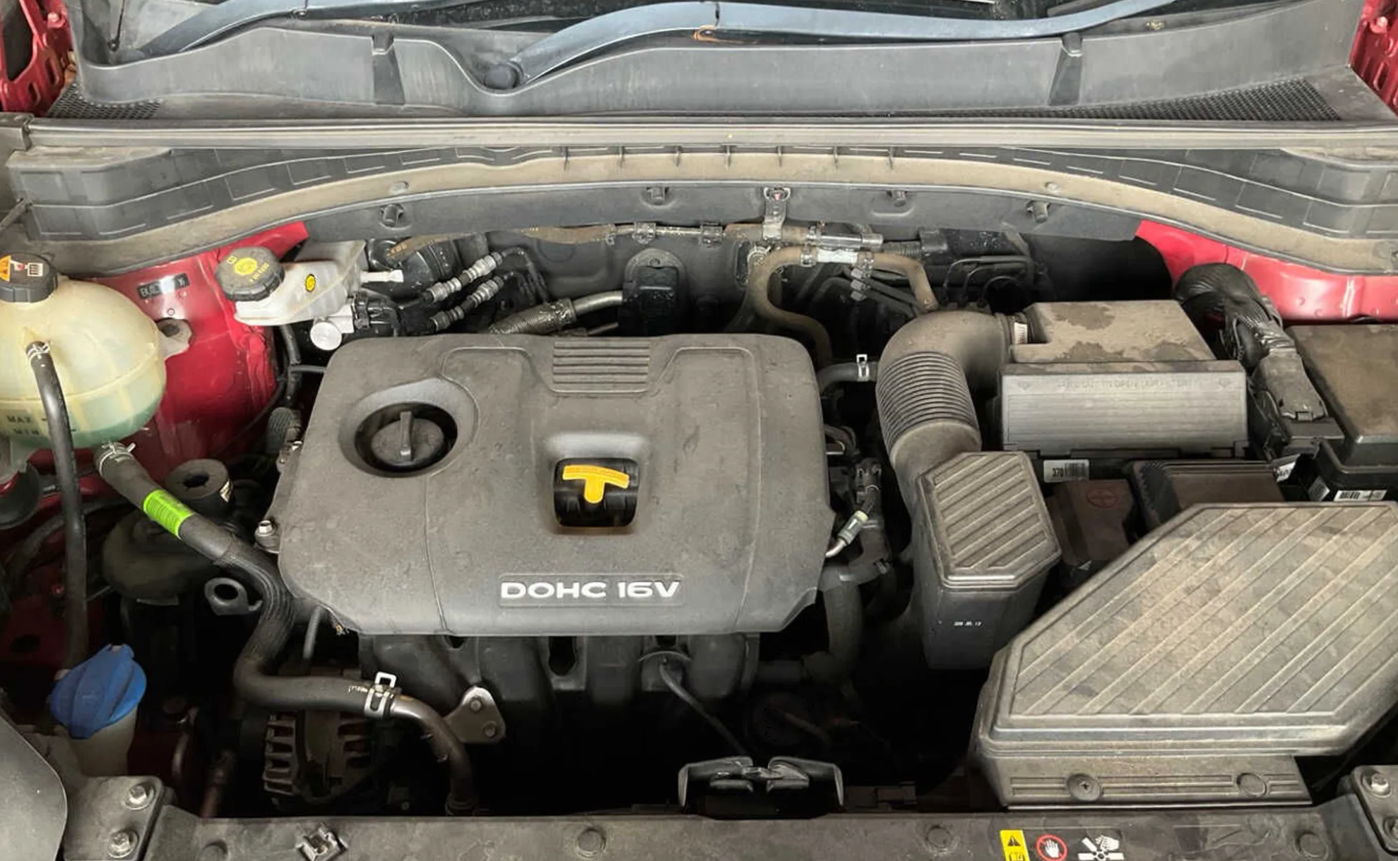 Red 2016 Kia Sportage QL donor, engine bay, 132700 km odometer and compliance plate