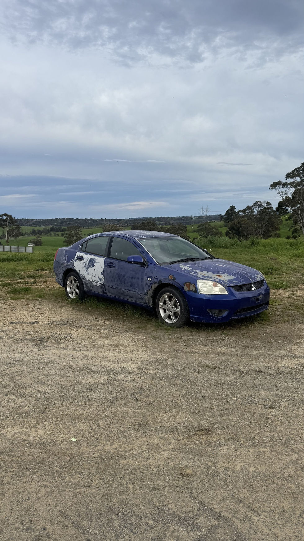 Blue Mitsubishi 380 donor - right front