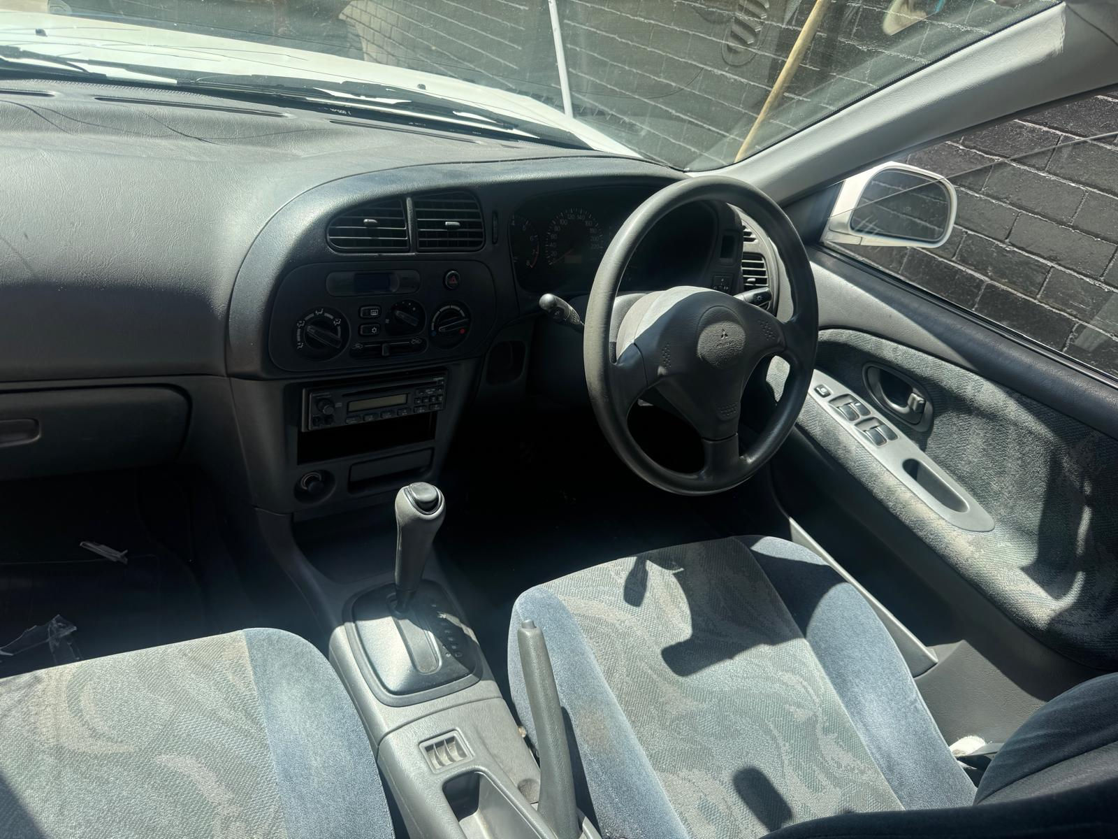1999 Lancer CE white sedan - Centre Dashboard Air Vents - photo 1