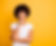 image showing a woman with an inquisitive look on her face against a yellow background