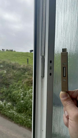 Locksmith replacing faulty uPVC door lock mechanism to restore security.