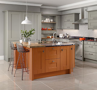 Elegant shaker-style kitchen with wooden island, grey cabinets, and lighting.