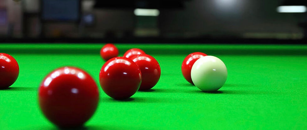 Close-up of snooker balls arranged on a green baize table