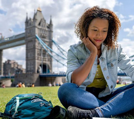 student studying with tower bridge in teh background