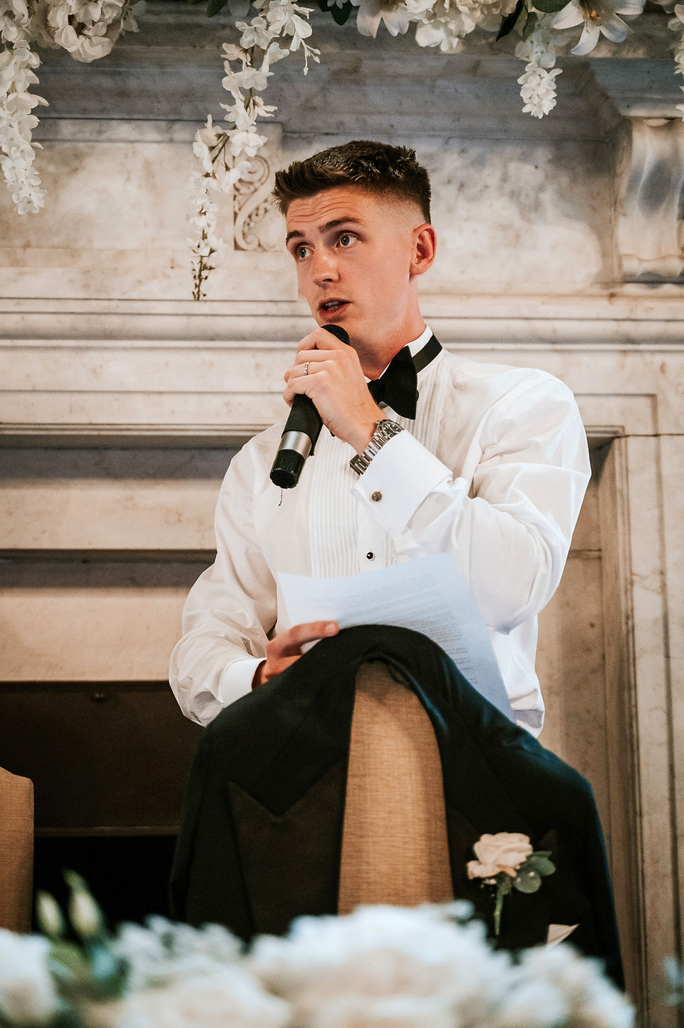 Essex Wedding Photographer documenting the groom giving his emotional wedding speech in the elegant surroundings of Gosfield Hall.
