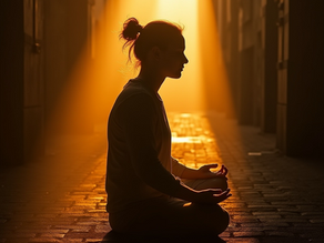 Woman sitting in meditation pose on a cobblestone street, surrounded by warm sunlight beams in an urban alley. Represents modern spirituality, emotional stillness, and the illusion of inner peace in a disconnected world.