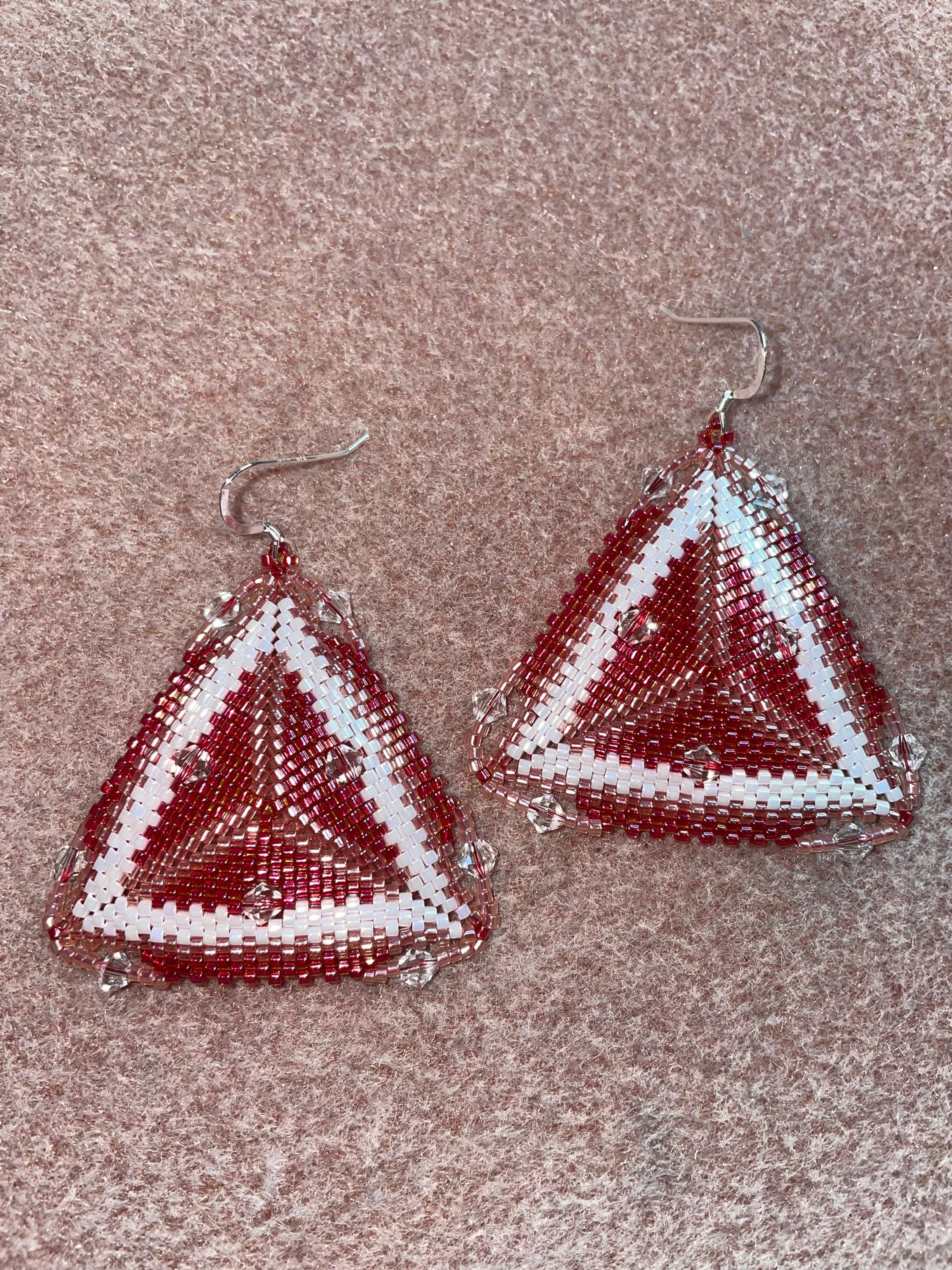 Red, white, and peach earrings with transparent Swarovski crystals.