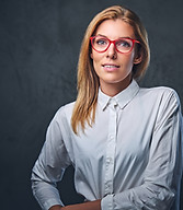 attractive-blond-business-woman-white-shirt-grey-background.jpg
