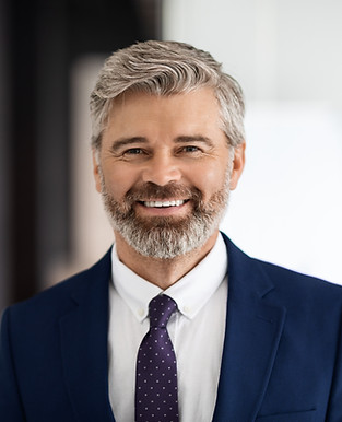 portrait-handsome-smiling-middle-aged-businessman-wearing-suit-looking-camera.jpg