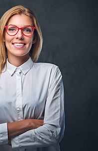 attractive-blond-business-woman-white-shirt-eyeglasses-crossed-arms-grey-background.jpg