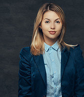portrait-sensual-blonde-business-woman-dressed-formal-suit-blue-shirt-isolated-dark-backgr