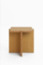 Wooden coffee table with a unique, cross-shaped base.