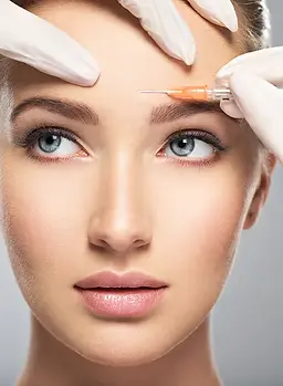 Portrait of young Caucasian woman getting cosmetic injection of botox in forehead_ Beauti