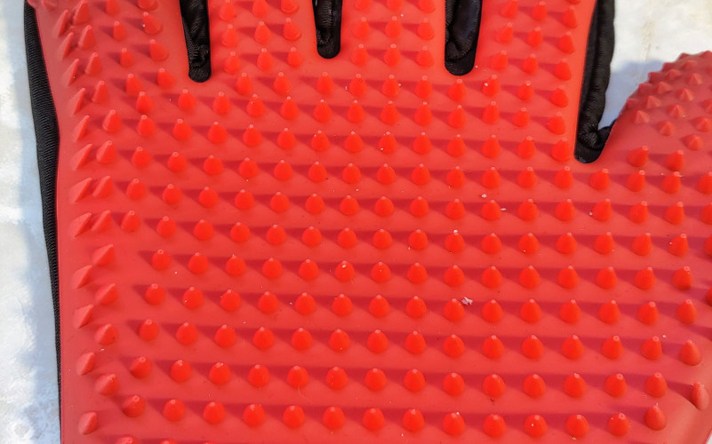 A close up of the rubber treads on Awinner Pet grooming glove