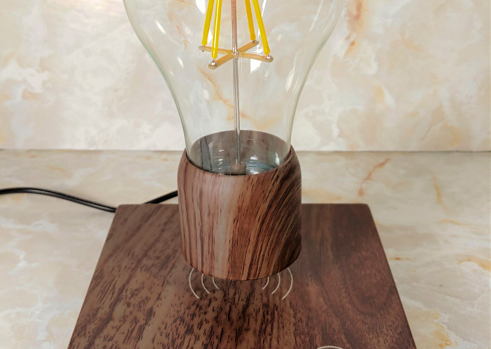 KFISI Magnetic Suspension Desk Light is displayed levitating above a platform